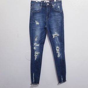Distress ankle skinny jeans
